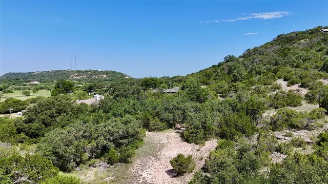 a view of a large building with a yard