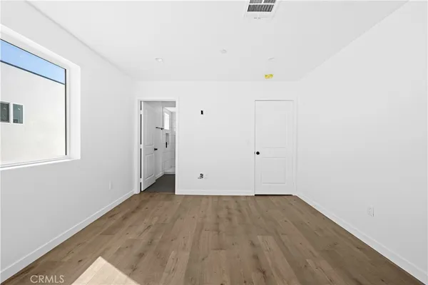 a view of room with walk in closet and window