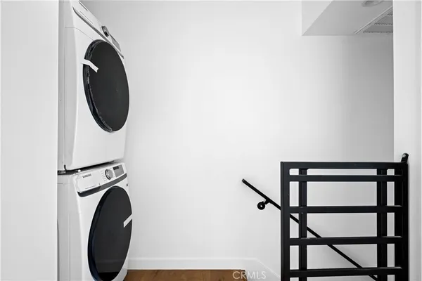 a close view of a utility room with dryer and washer