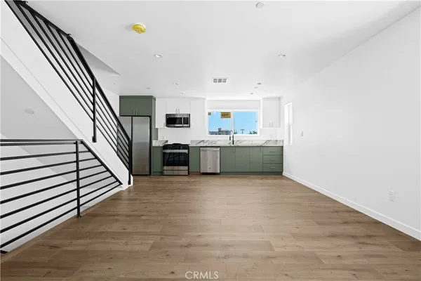 a view of a kitchen with microwave and stove