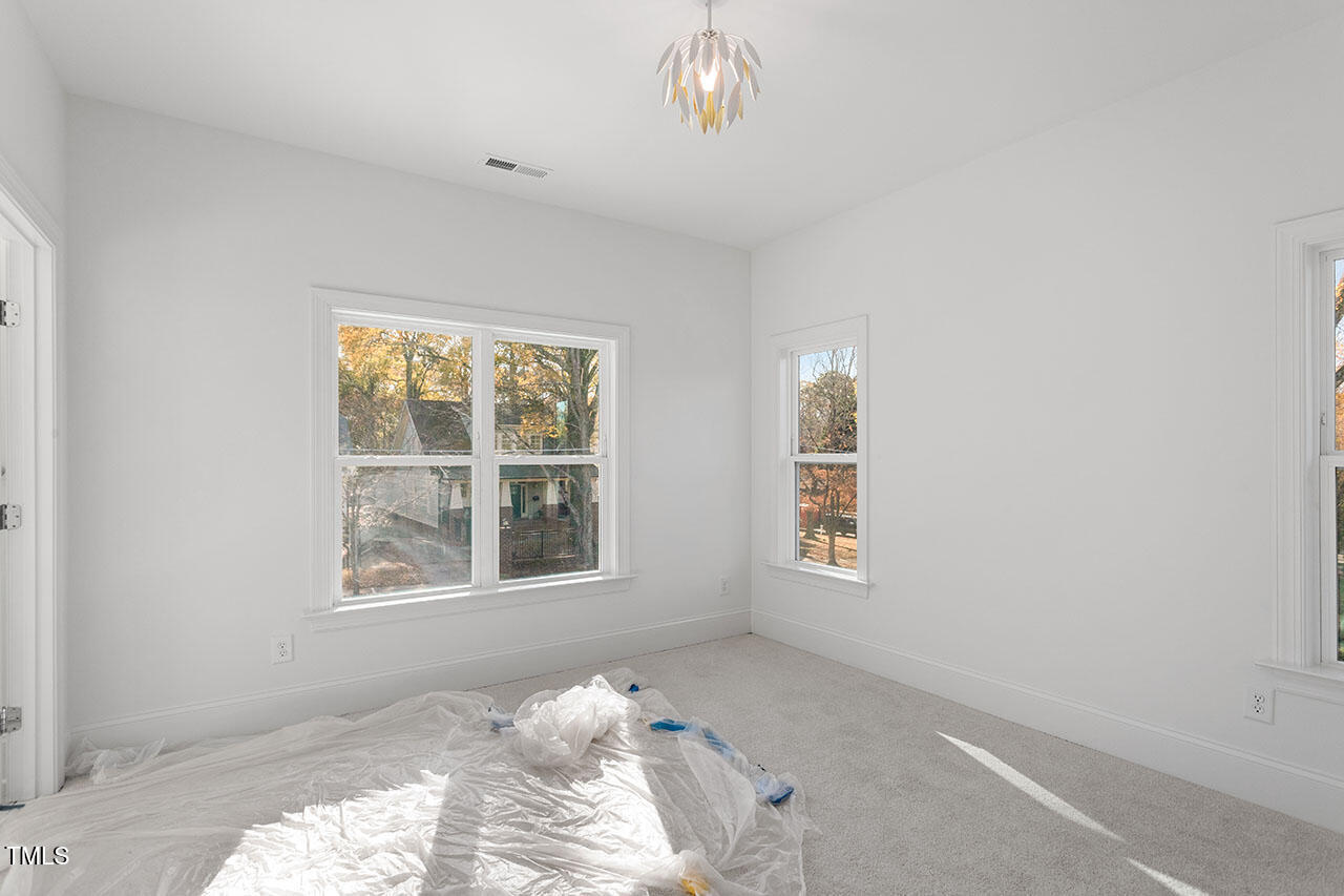 2406 Everett Avenue Raleigh, NC 27607 - Photo 16 of 40 a bedroom with bed and a window