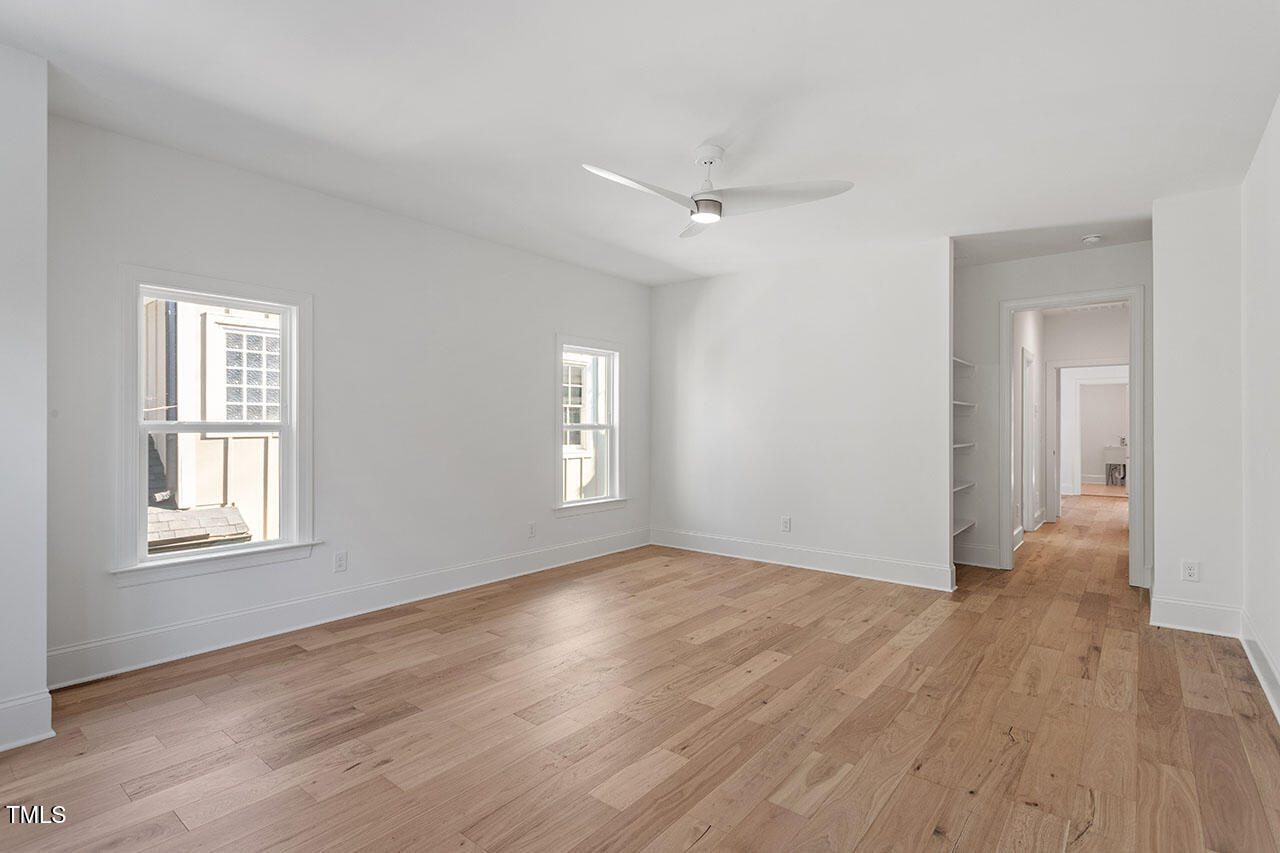 2406 Everett Avenue Raleigh, NC 27607 - Photo 20 of 40 a view of an empty room with wooden floor and a window