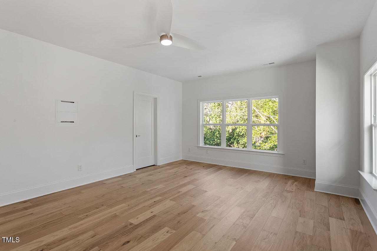 2406 Everett Avenue Raleigh, NC 27607 - Photo 22 of 40 an empty room with wooden floor and windows