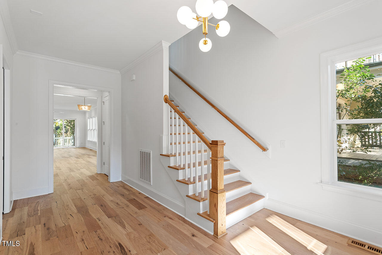 2406 Everett Avenue Raleigh, NC 27607 - Photo 26 of 40 a view of entryway and hall with wooden floor