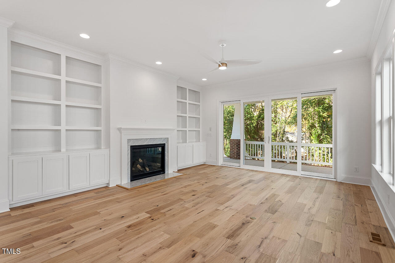 2406 Everett Avenue Raleigh, NC 27607 - Photo 36 of 40 a view of an empty room with a window and fireplace