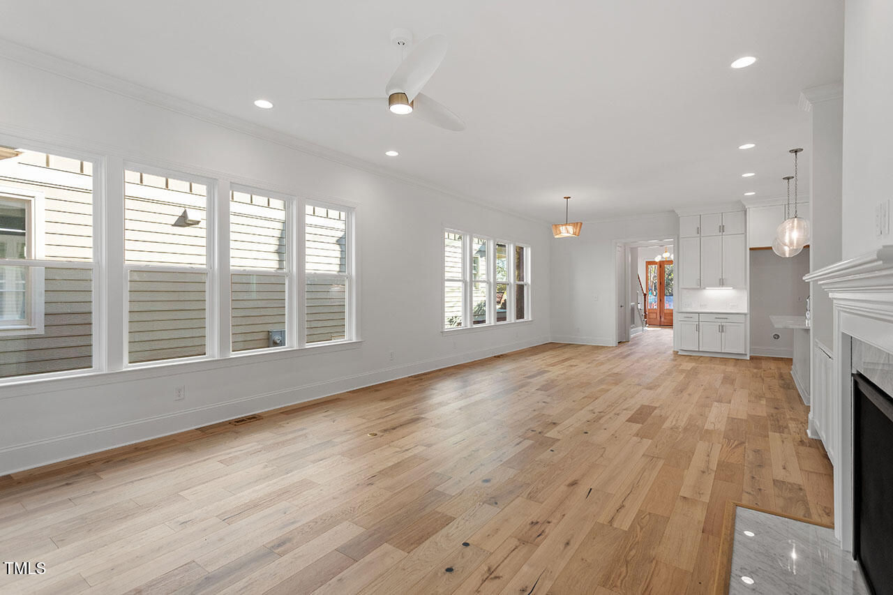 2406 Everett Avenue Raleigh, NC 27607 - Photo 38 of 40 a view of an empty room with a window and wooden floor