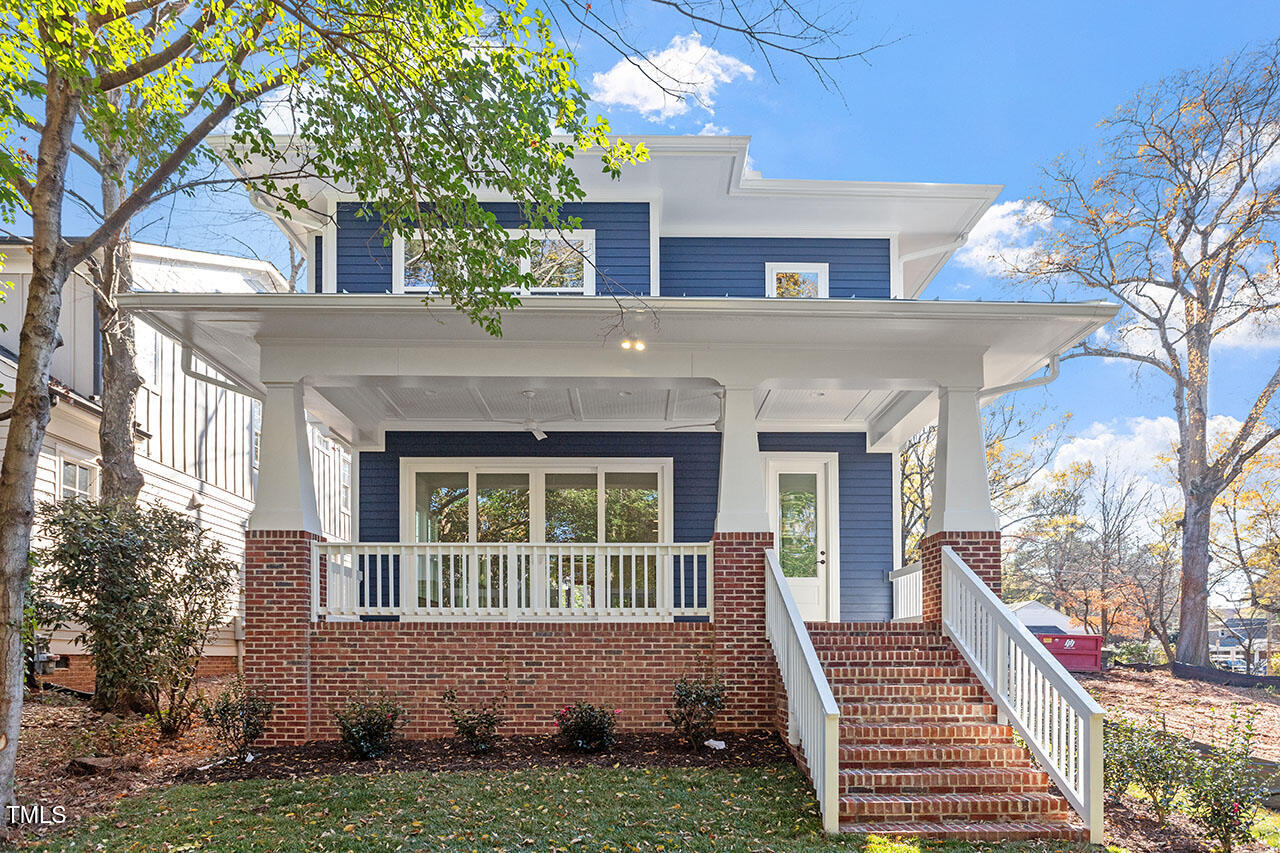 2406 Everett Avenue Raleigh, NC 27607 - Photo 4 of 40 a front view of a house with a yard