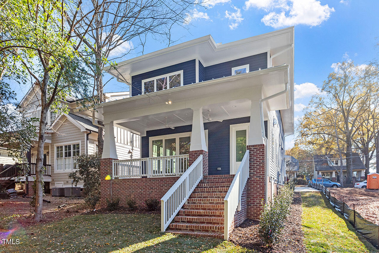 2406 Everett Avenue Raleigh, NC 27607 - Photo 6 of 40 a front view of a house with a yard