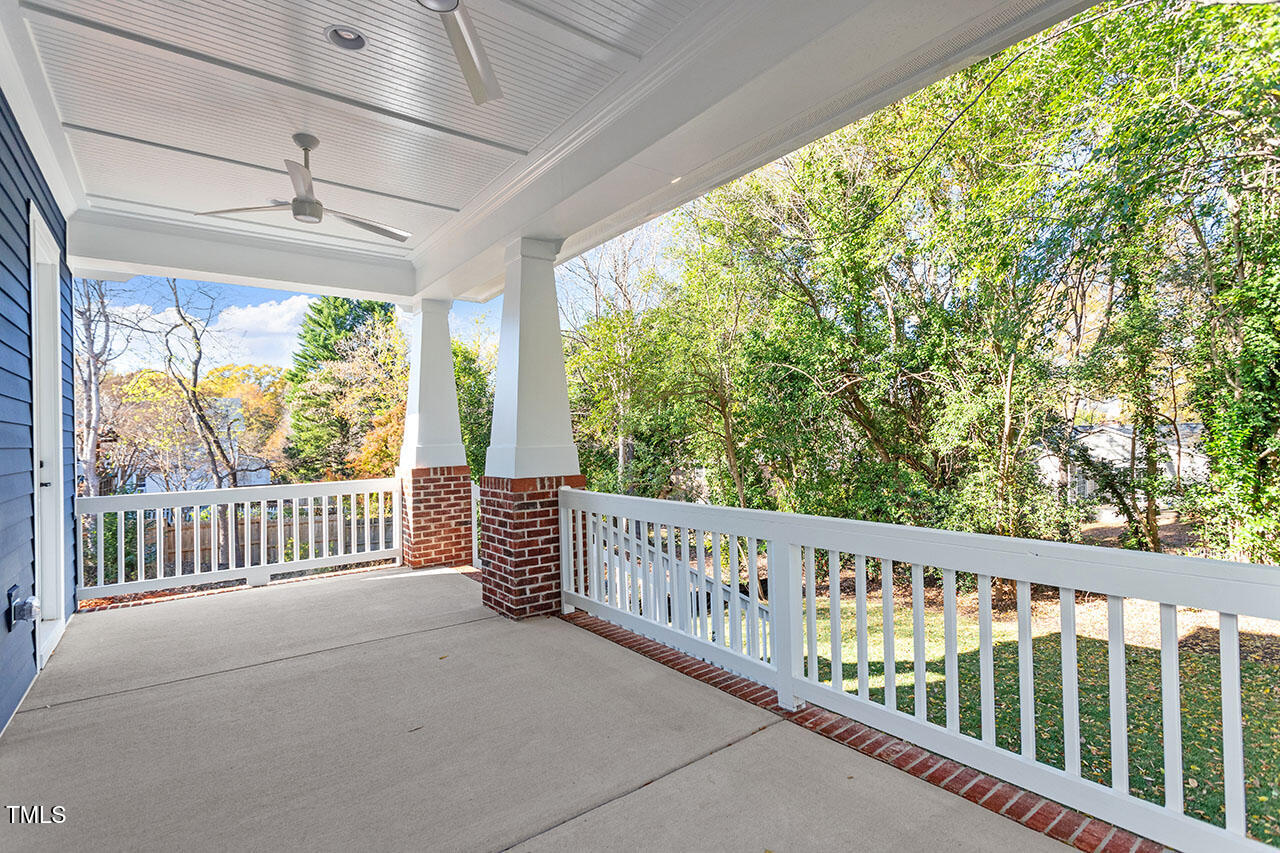 2406 Everett Avenue Raleigh, NC 27607 - Photo 9 of 40 a view of a porch with wooden floor and outdoor space
