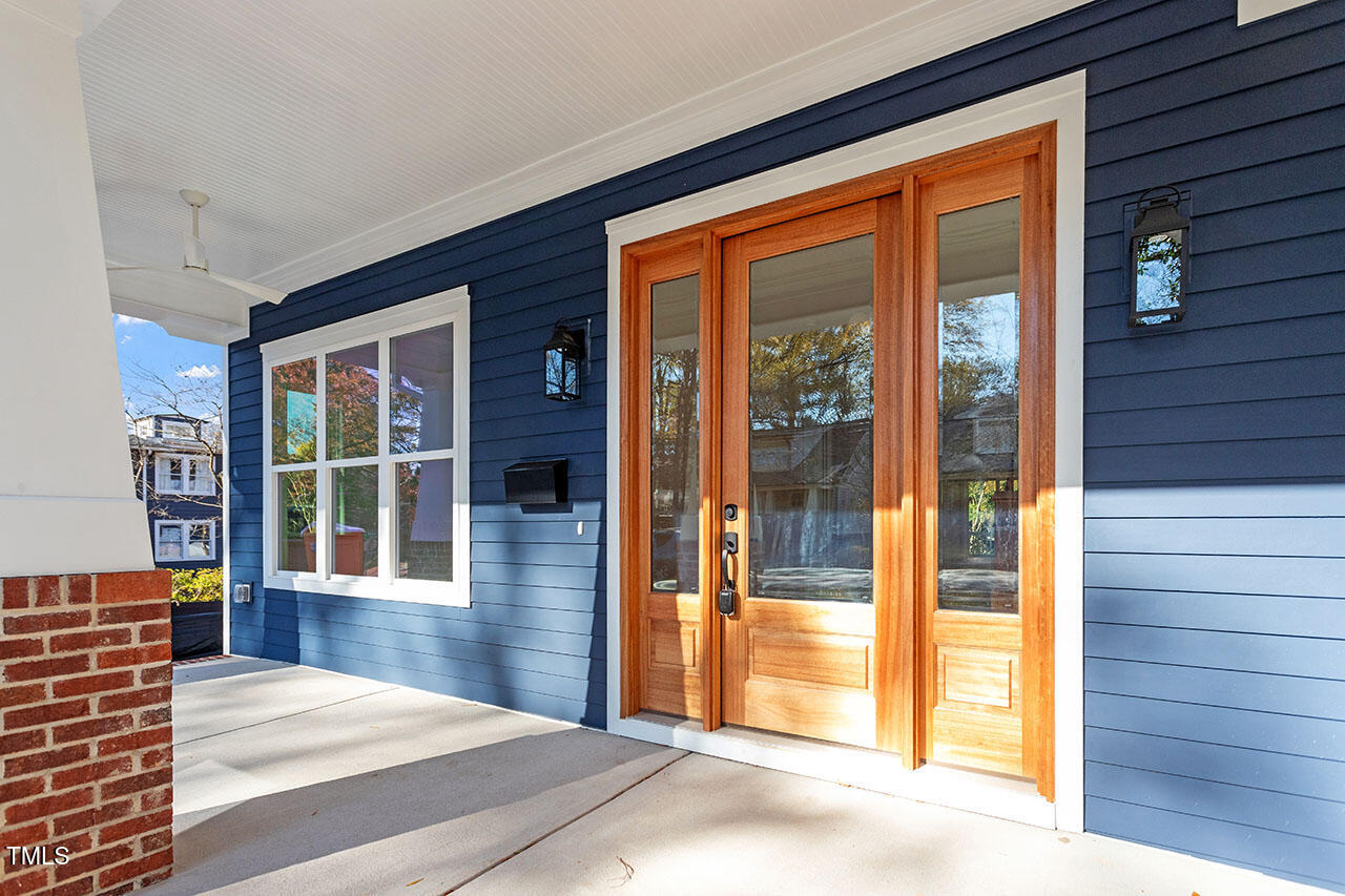 2406 Everett Avenue Raleigh, NC 27607 - Photo 10 of 40 a view of a porch with wooden floor and balcony