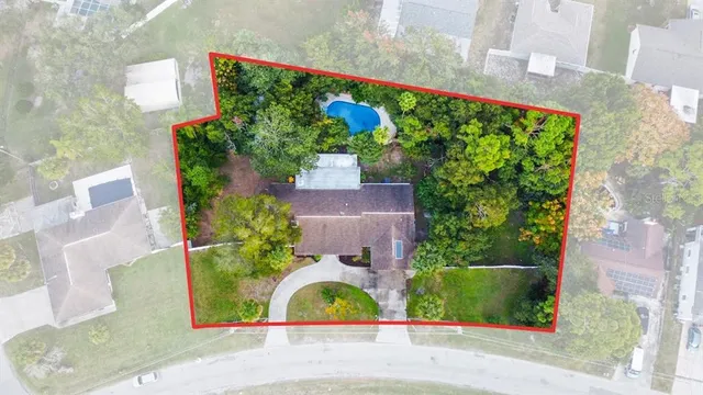 front view of a house with a yard and fountain