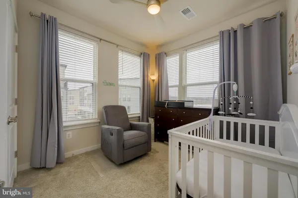 a bedroom with furniture and windows