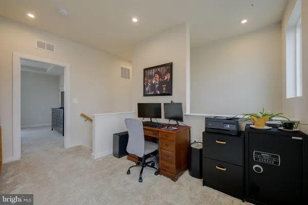 a view of a workspace with furniture