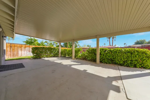 a view of a backyard with potted plants