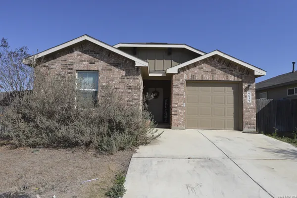 a front view of a house with garage