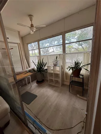 a view of a hallway with paintings on the wall