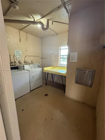 a view of a hallway with staircase