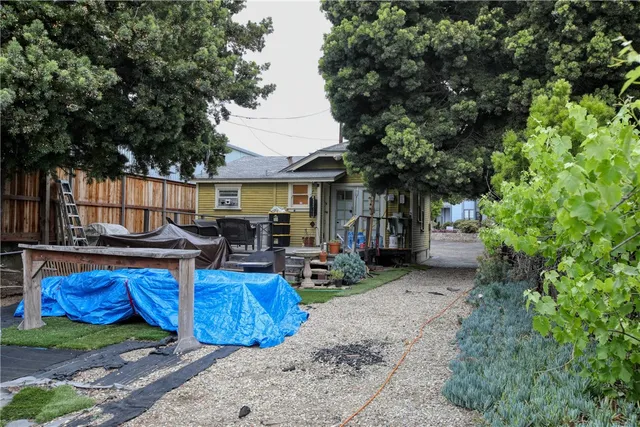 a view of patio with chairs and potted plants