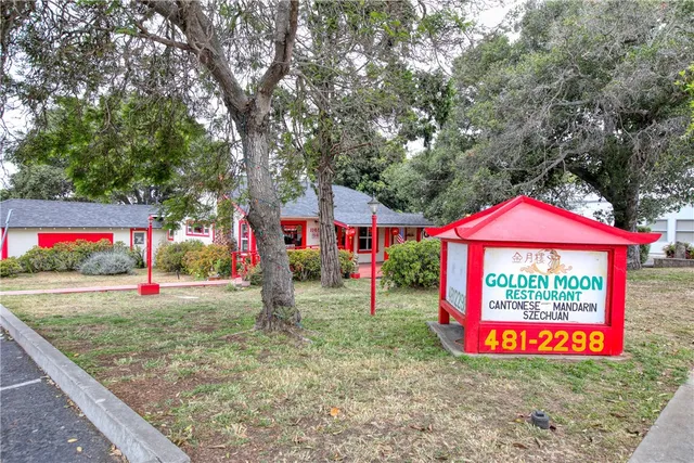 an outdoor space with furniture and umbrella