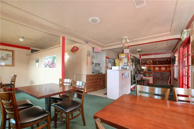 a bathroom with a sink toilet and a mirror