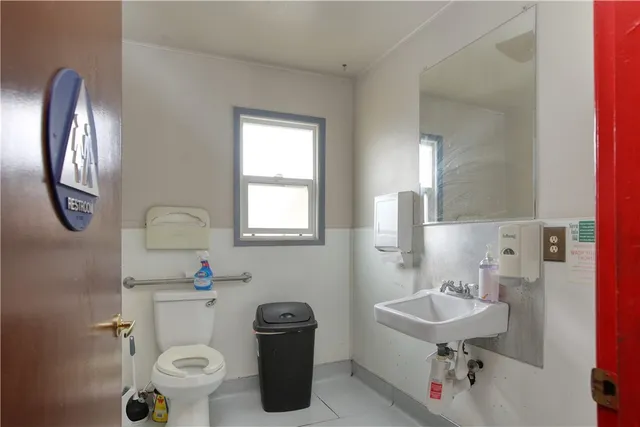 a outdoor space with lots of chairs and chandelier