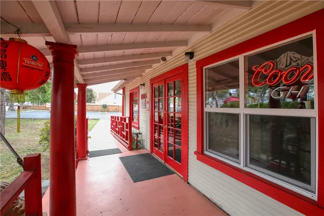 a view of a house with a yard and garage