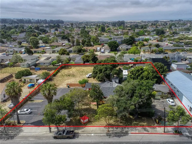 an aerial view of residential houses and outdoor space