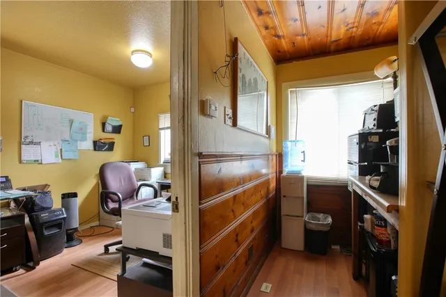 a kitchen with a sink appliances and cabinets