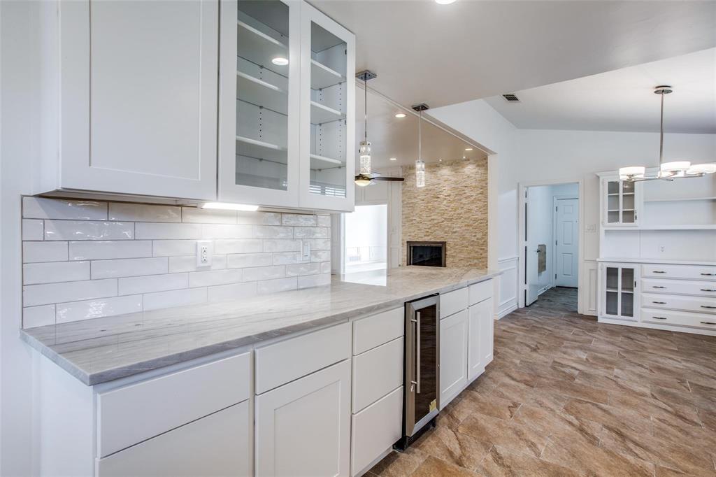 6926 Northwood Road Dallas, TX 75225 - Photo 14 of 29 a kitchen with stainless steel appliances granite countertop a sink and a refrigerator