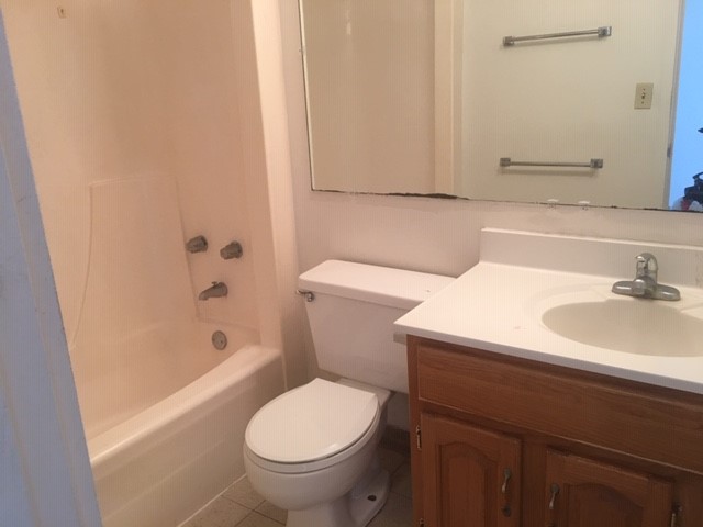 84 Pukihae Street, Unit 804 Hilo, HI 96720 - Photo 8 of 16 a bathroom with a sink a toilet and shower