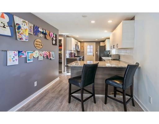 1 Dickie Road Woburn, MA 01801 - Photo 5 of 22 a view of a dining room with a table and chairs