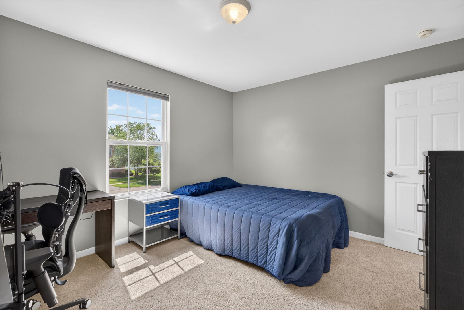 25204 Spring Street Manhattan, IL 60442 - Photo 23 of 34 a bedroom with a bed and a table in it