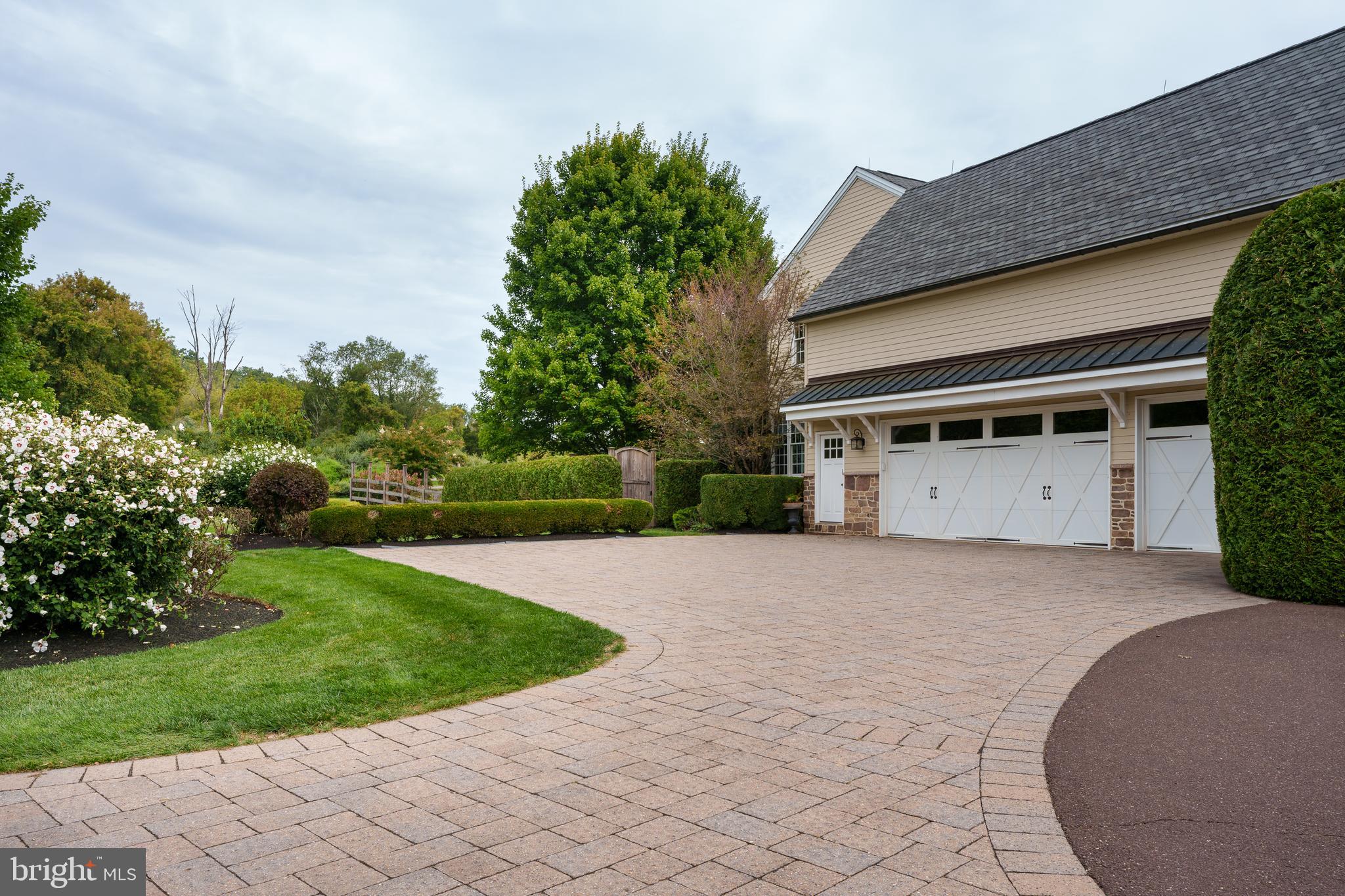 6997 Phillips Mill Road New Hope, PA 18938 - Photo 14 of 85 a front view of a house with a yard and garage