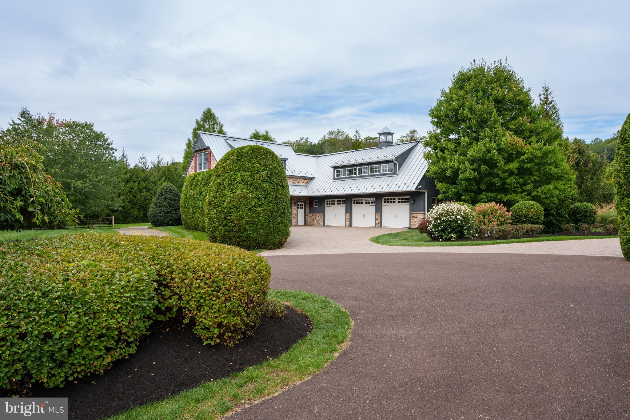 6997 Phillips Mill Road New Hope, PA 18938 - Photo 15 of 85 a front view of a house with a yard and garage