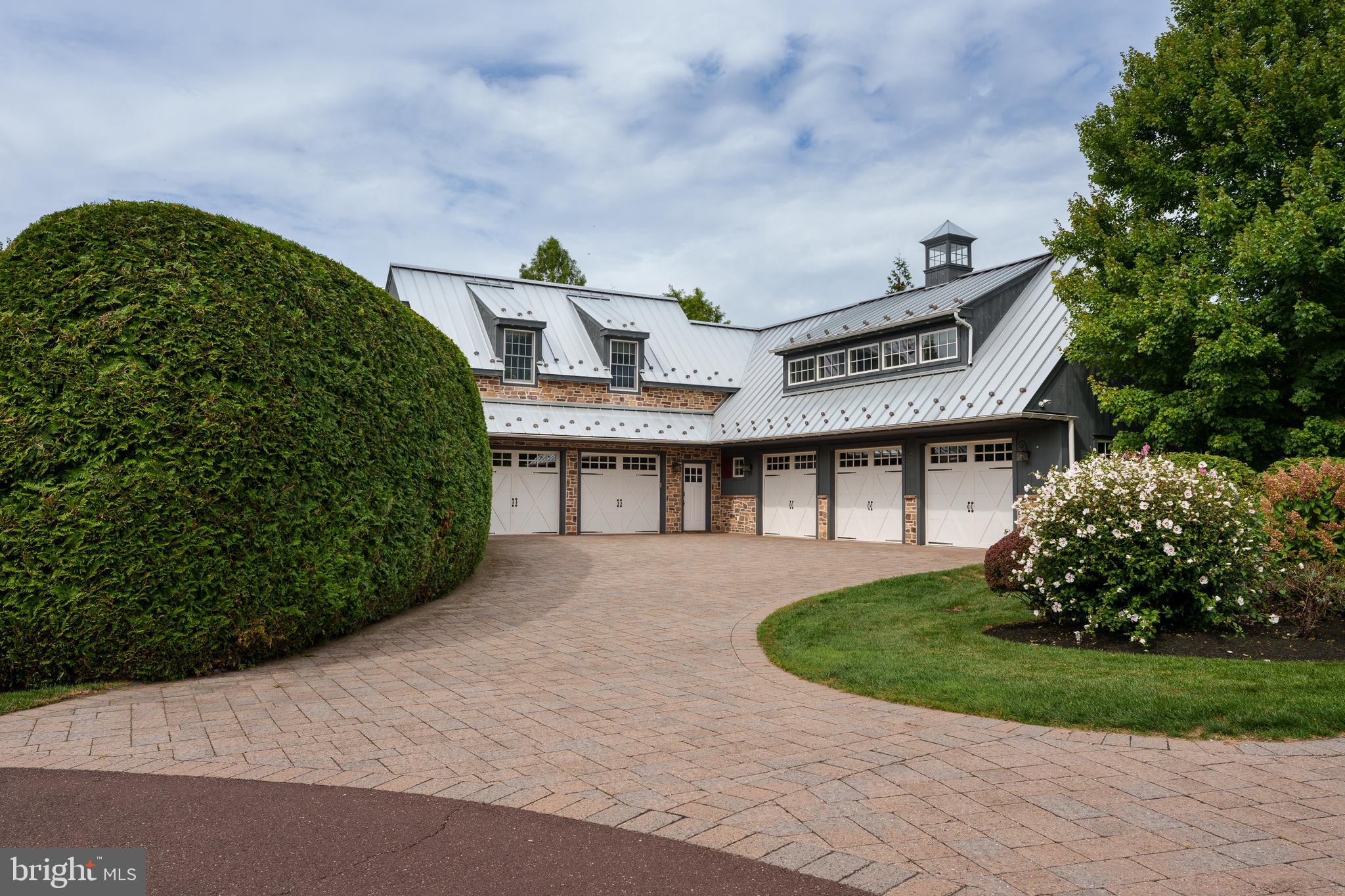 6997 Phillips Mill Road New Hope, PA 18938 - Photo 16 of 85 a front view of a house with a garden