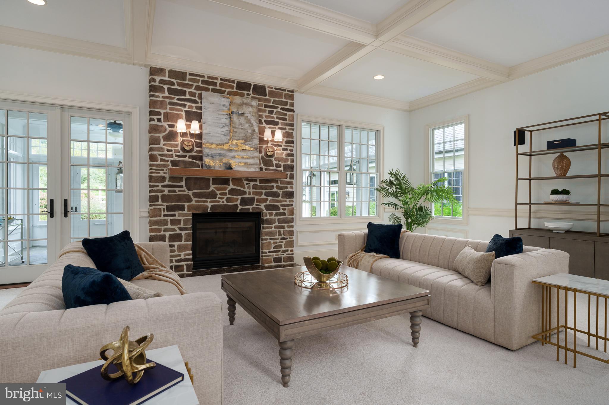 6997 Phillips Mill Road New Hope, PA 18938 - Photo 26 of 85 a living room with furniture large window and a fireplace