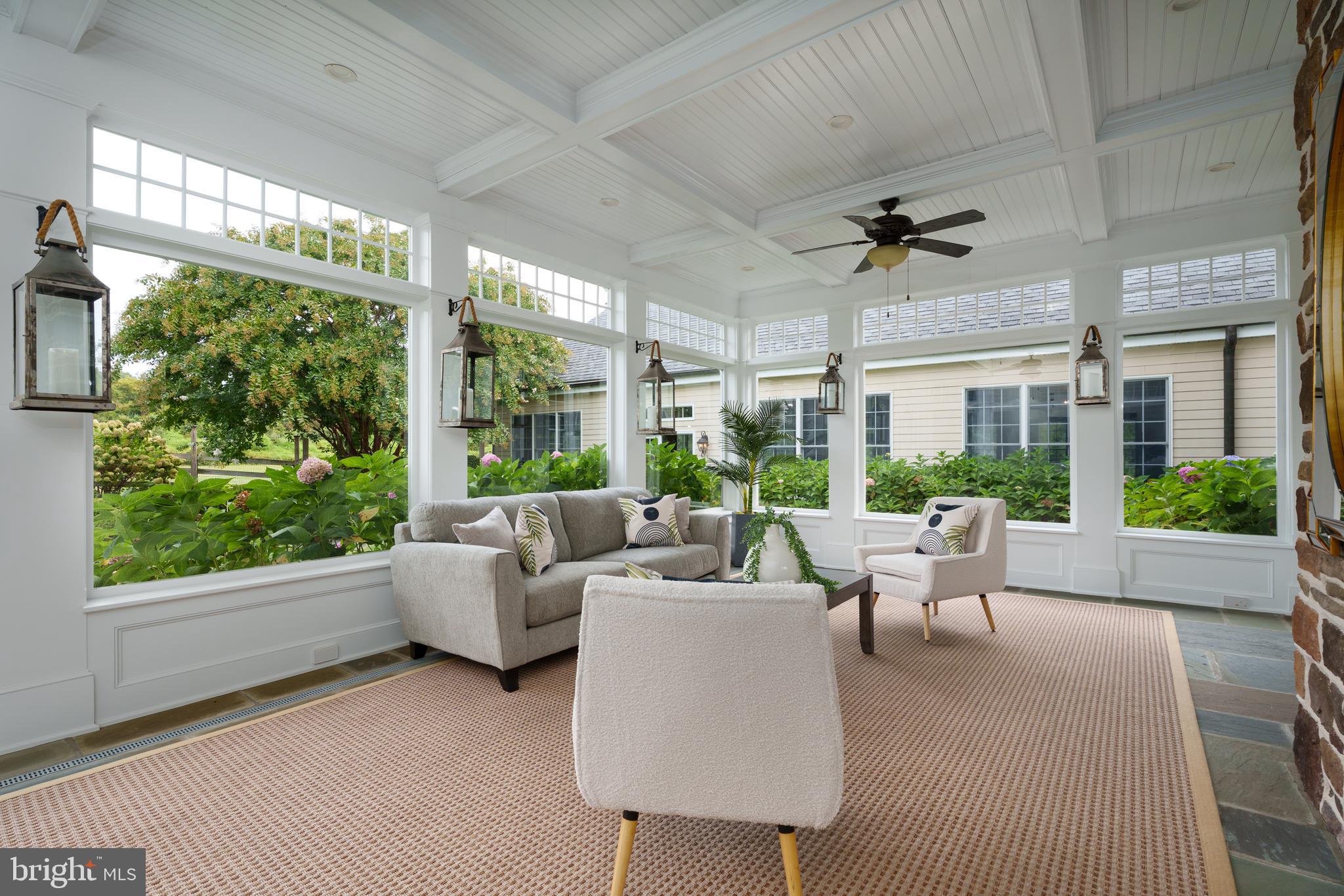 6997 Phillips Mill Road New Hope, PA 18938 - Photo 28 of 85 a living room with furniture and a large window