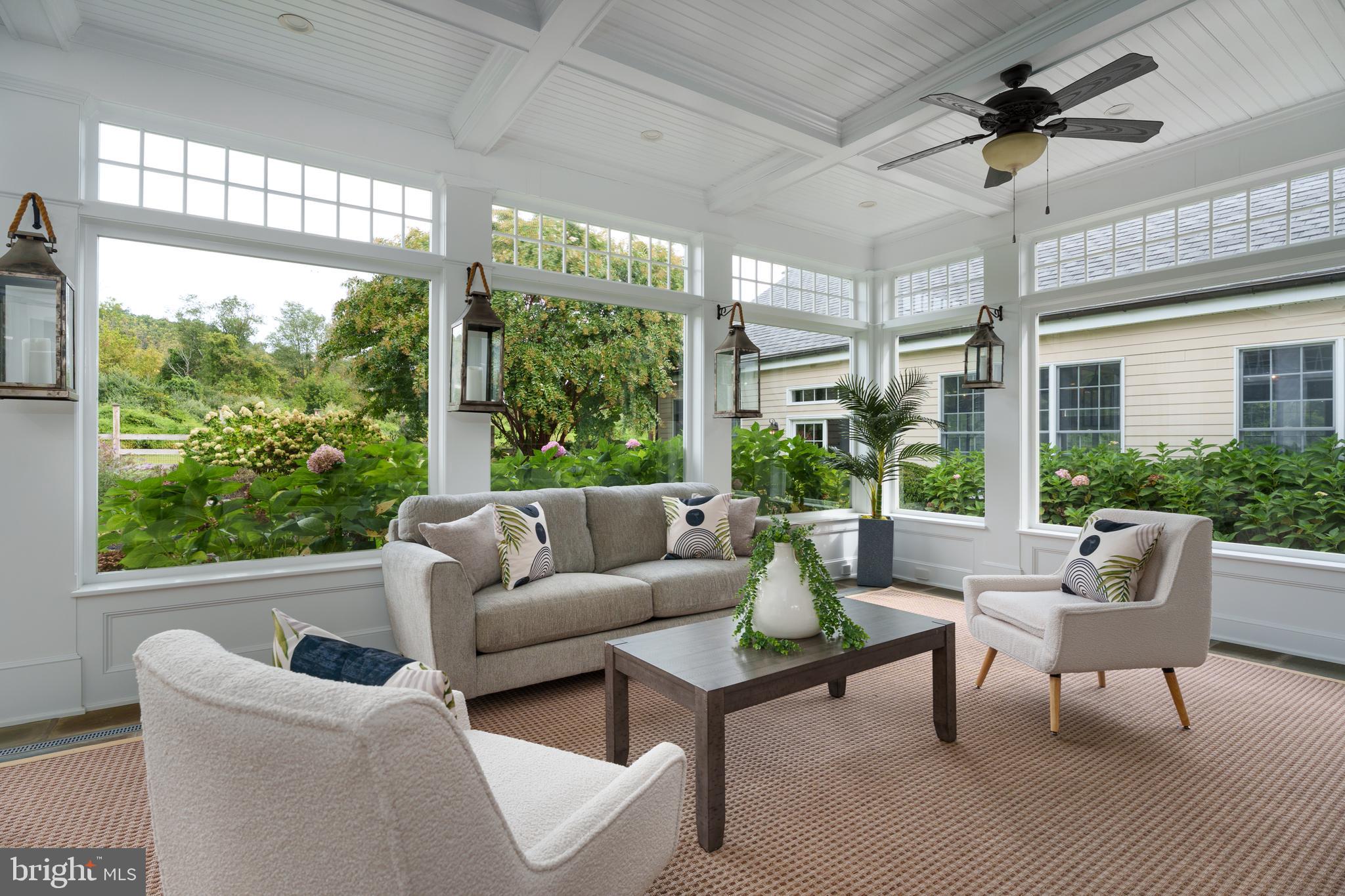 6997 Phillips Mill Road New Hope, PA 18938 - Photo 29 of 85 a living room with furniture and a large window
