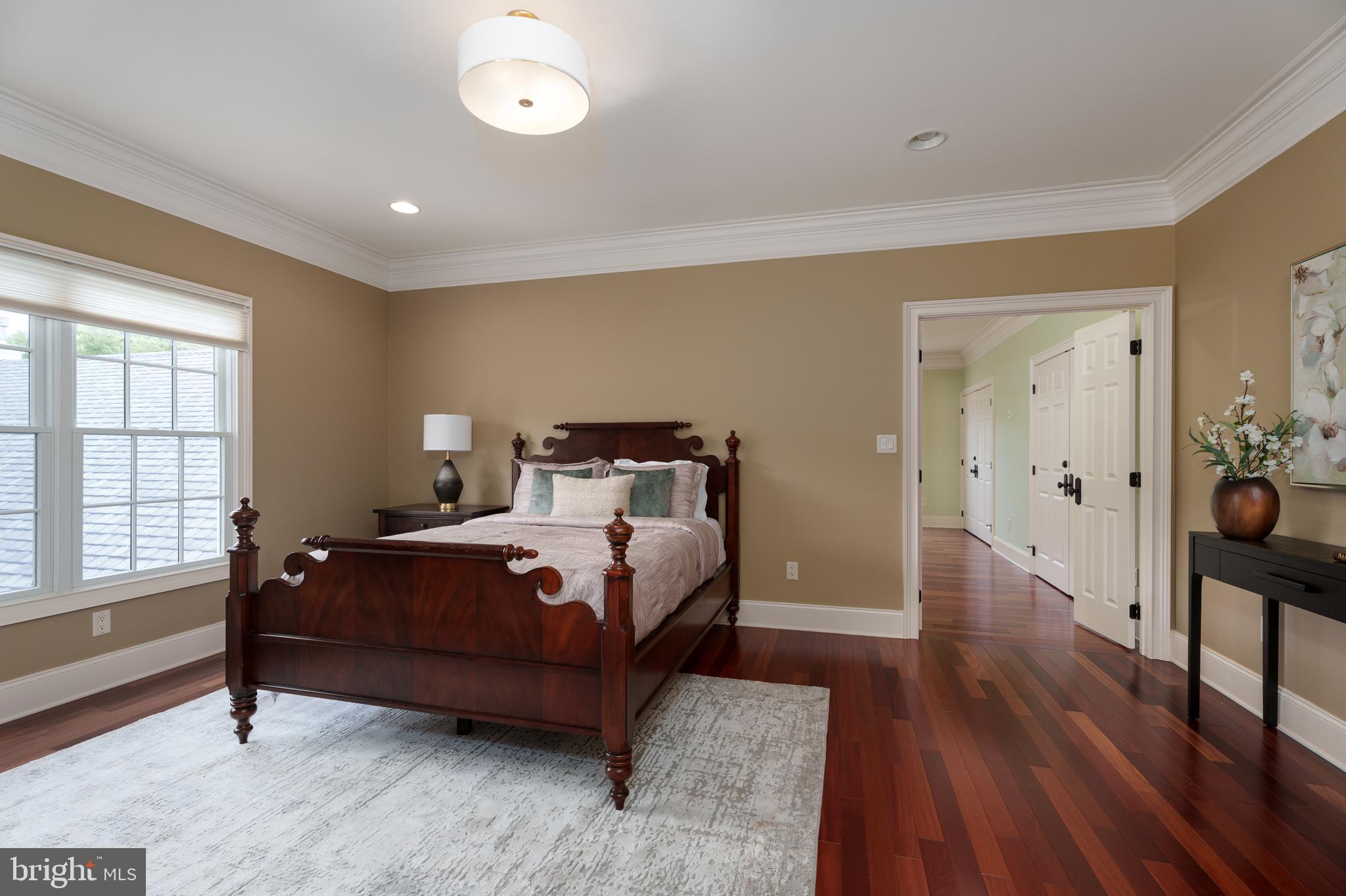 6997 Phillips Mill Road New Hope, PA 18938 - Photo 54 of 85 a bedroom with a bed and wooden floor