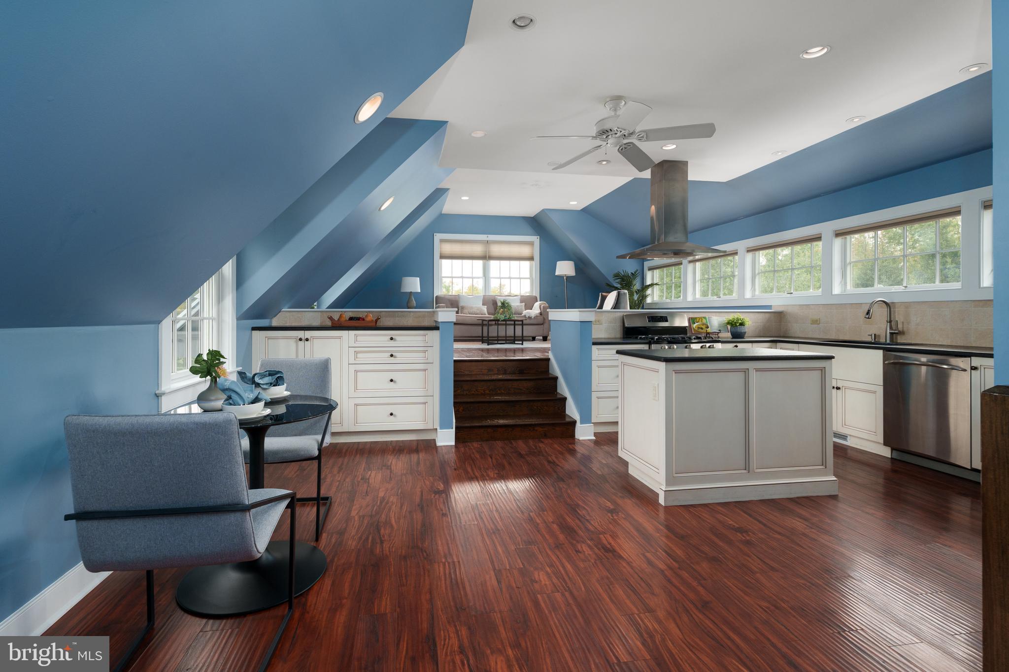 6997 Phillips Mill Road New Hope, PA 18938 - Photo 57 of 85 a kitchen with a stove a refrigerator and chairs