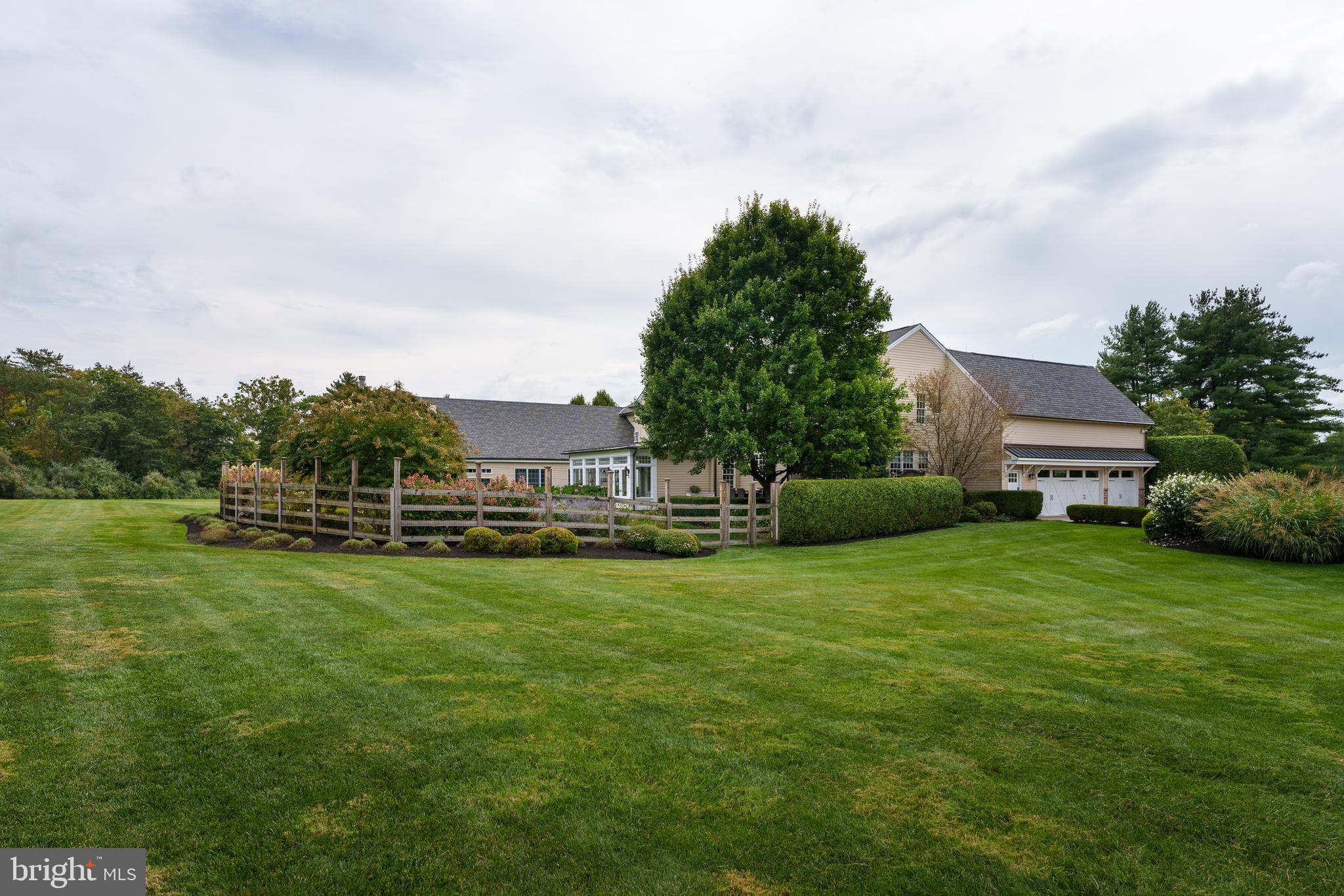 6997 Phillips Mill Road New Hope, PA 18938 - Photo 68 of 85 a view of a house with a big yard potted plants and large trees
