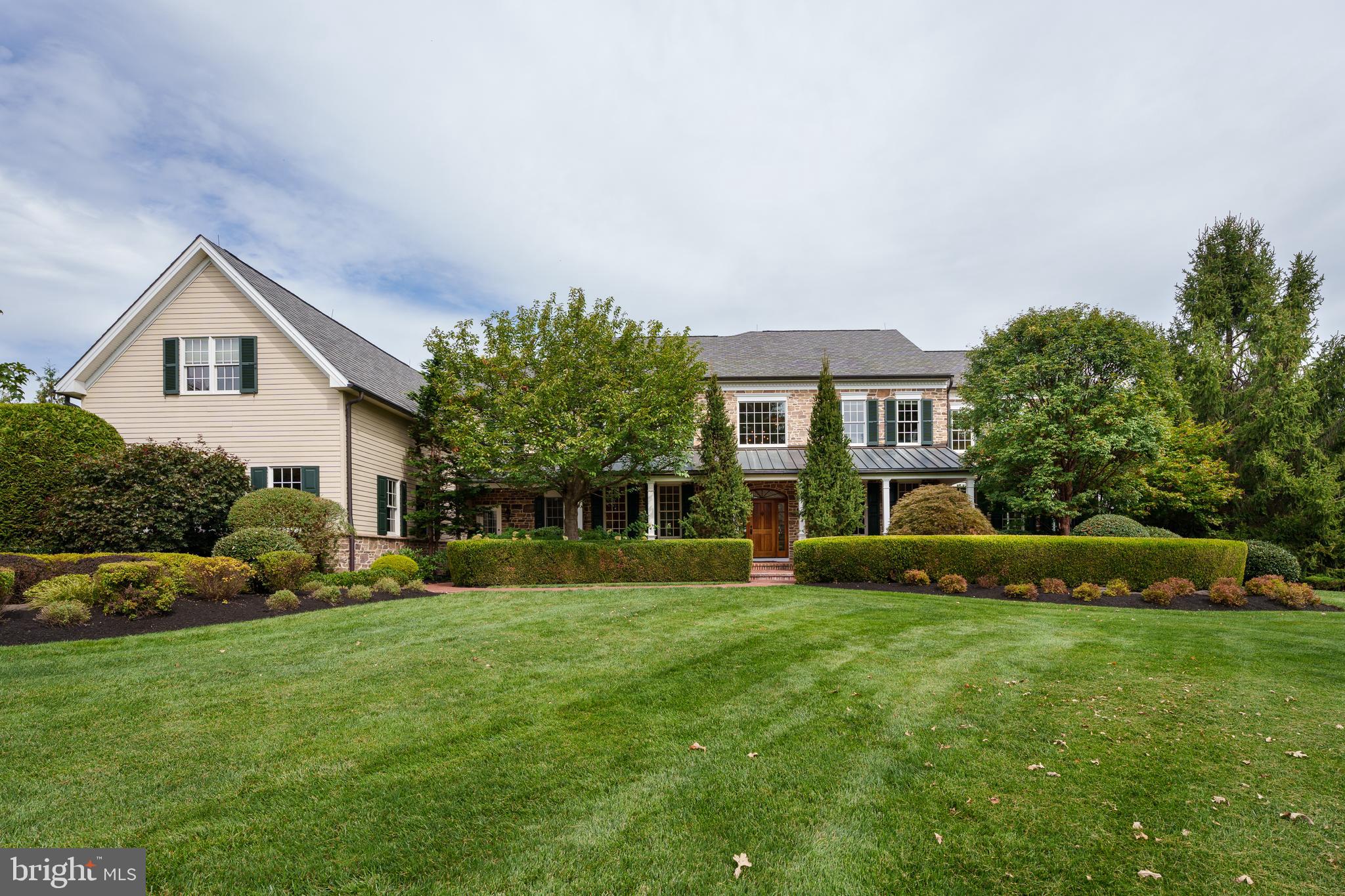 6997 Phillips Mill Road New Hope, PA 18938 - Photo 8 of 85 a front view of a house with a yard and trees