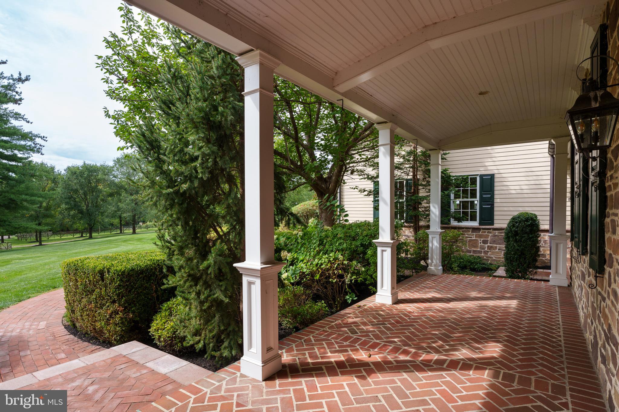 6997 Phillips Mill Road New Hope, PA 18938 - Photo 10 of 85 a view of a porch with furniture and garden