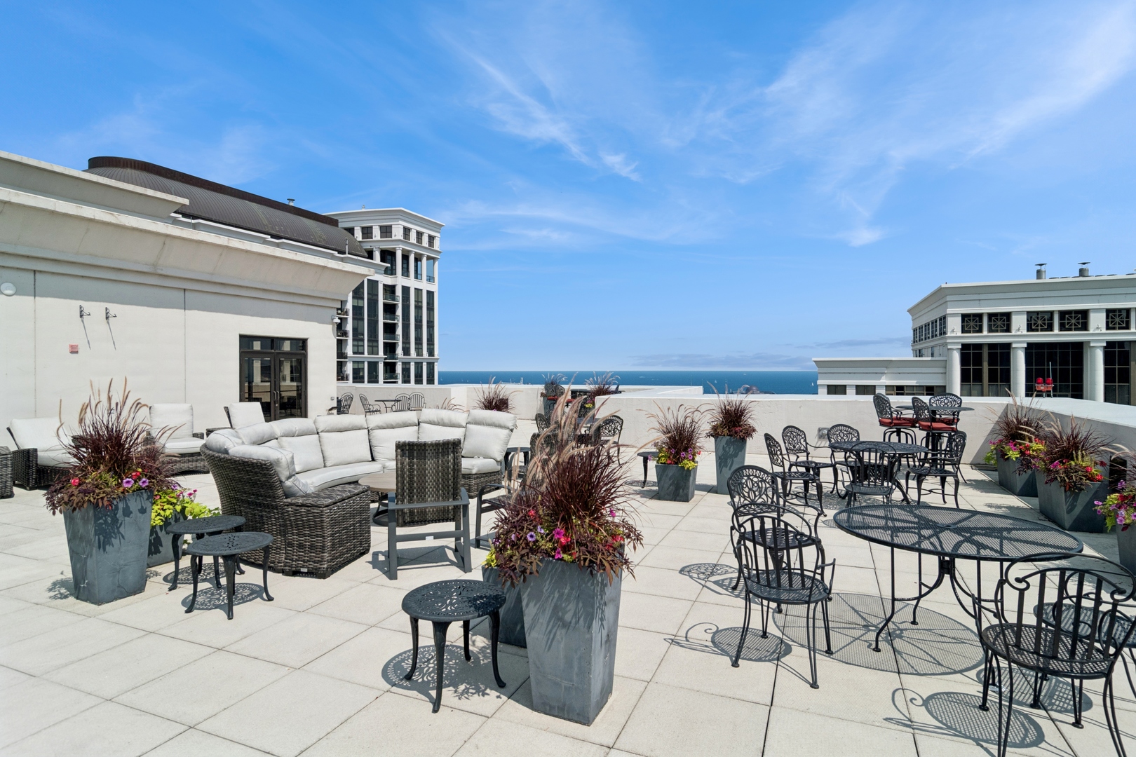 1322 South Prairie Avenue, Unit 801 Chicago, IL 60605 - Photo 22 of 24 a view of a patio with table and chairs and potted plants