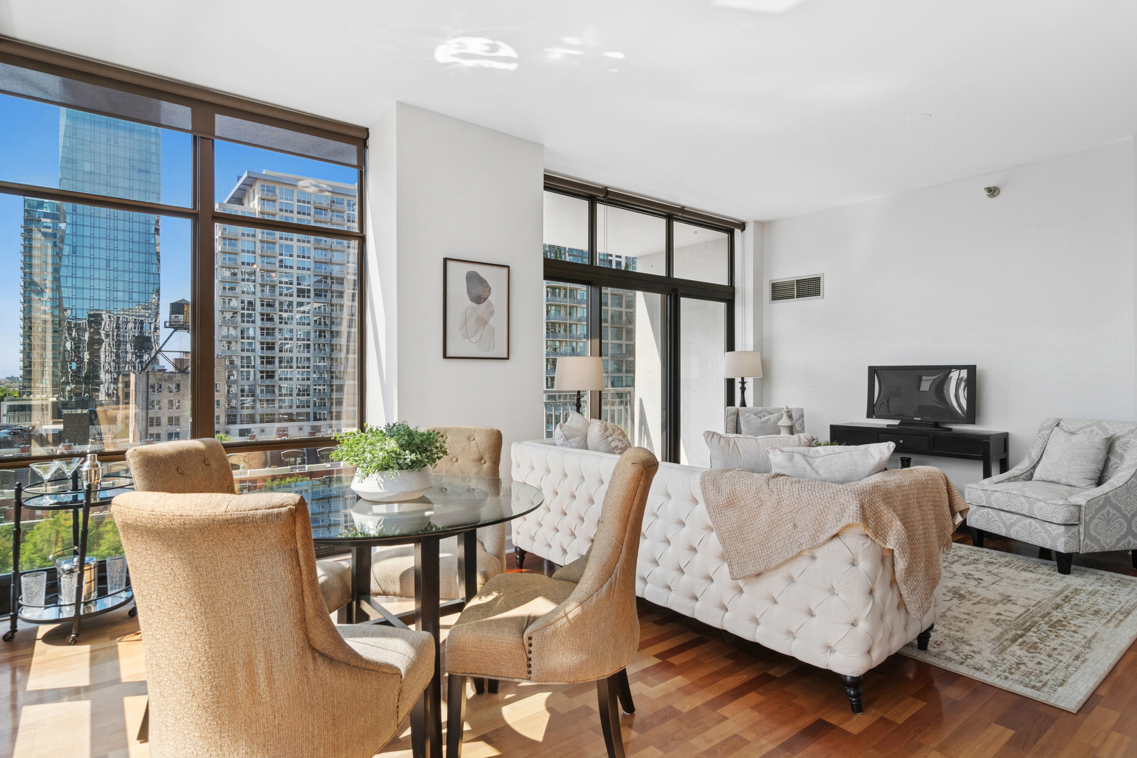 1322 South Prairie Avenue, Unit 801 Chicago, IL 60605 - Photo 7 of 24 a living room with furniture a large window and a flat screen tv