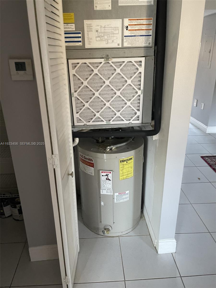 6606 Southwest 131st Path, Unit 1809A Miami, FL 33183 - Photo 14 of 14 a utility room with dryer and washer