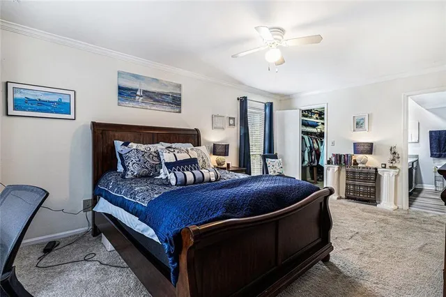 a bedroom with furniture and a ceiling fan