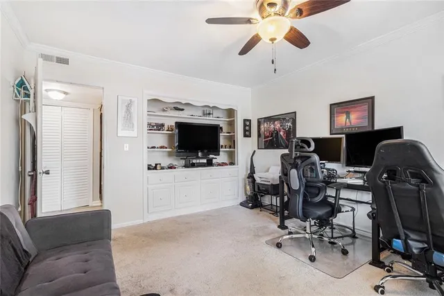 a view of a livingroom with workspace and a couch