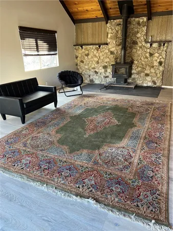 a view of a livingroom with furniture and a window