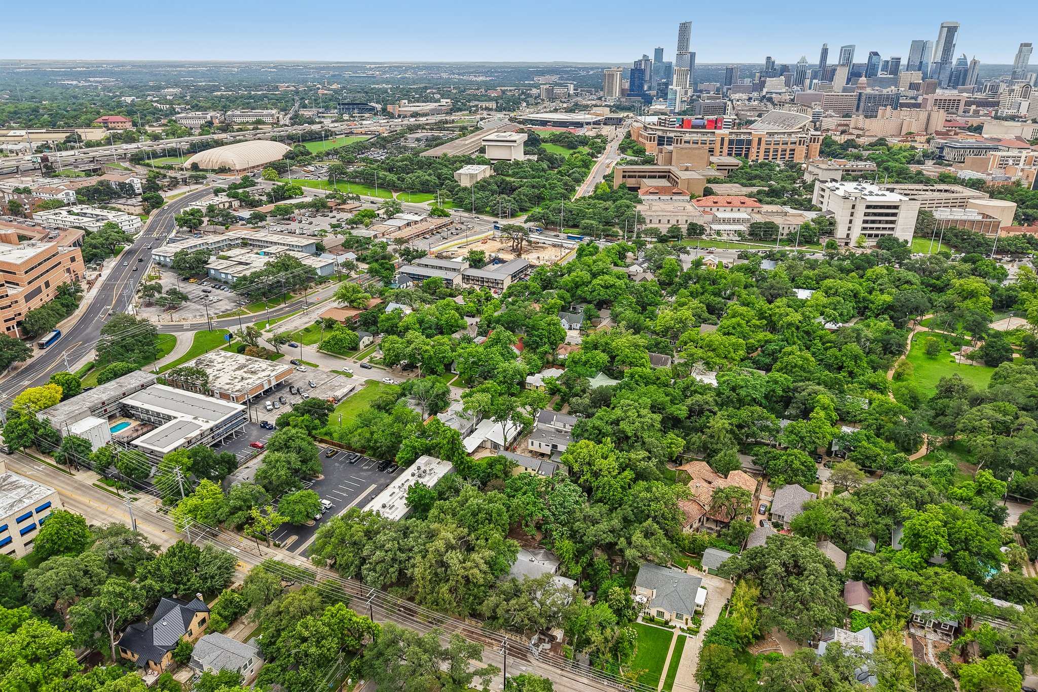 801 East 32nd Street Austin, TX 78705 - Photo 11 of 13 An aerial panorama reveals a dynamic urban landscape, blending residential tranquility with vibrant city life.